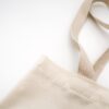 Photo by Mel Poole brown tote bag on white surface
