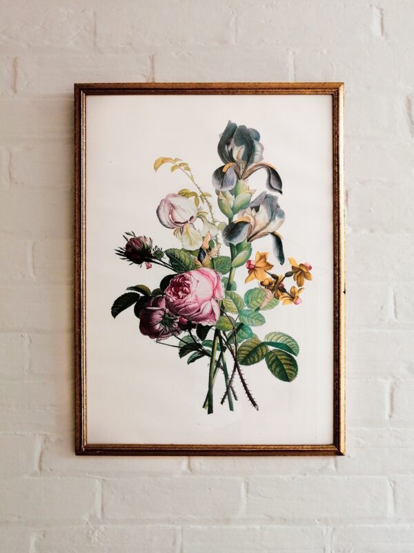 a picture of a bunch of flowers hanging on a wall